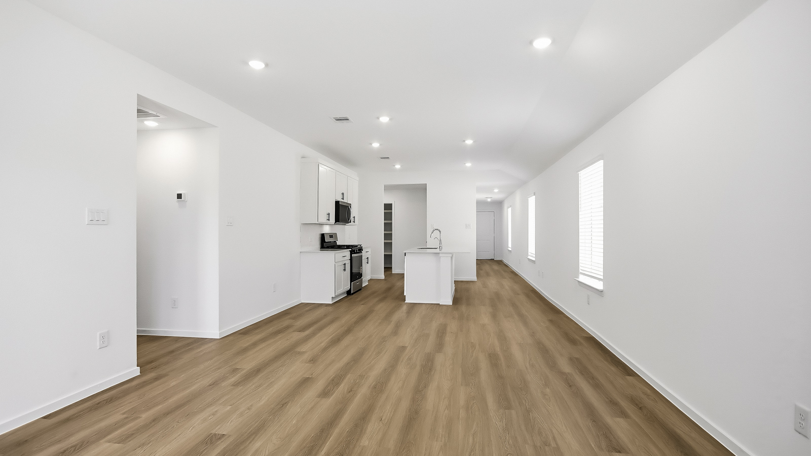 Open concept living, dining, and kitchen area