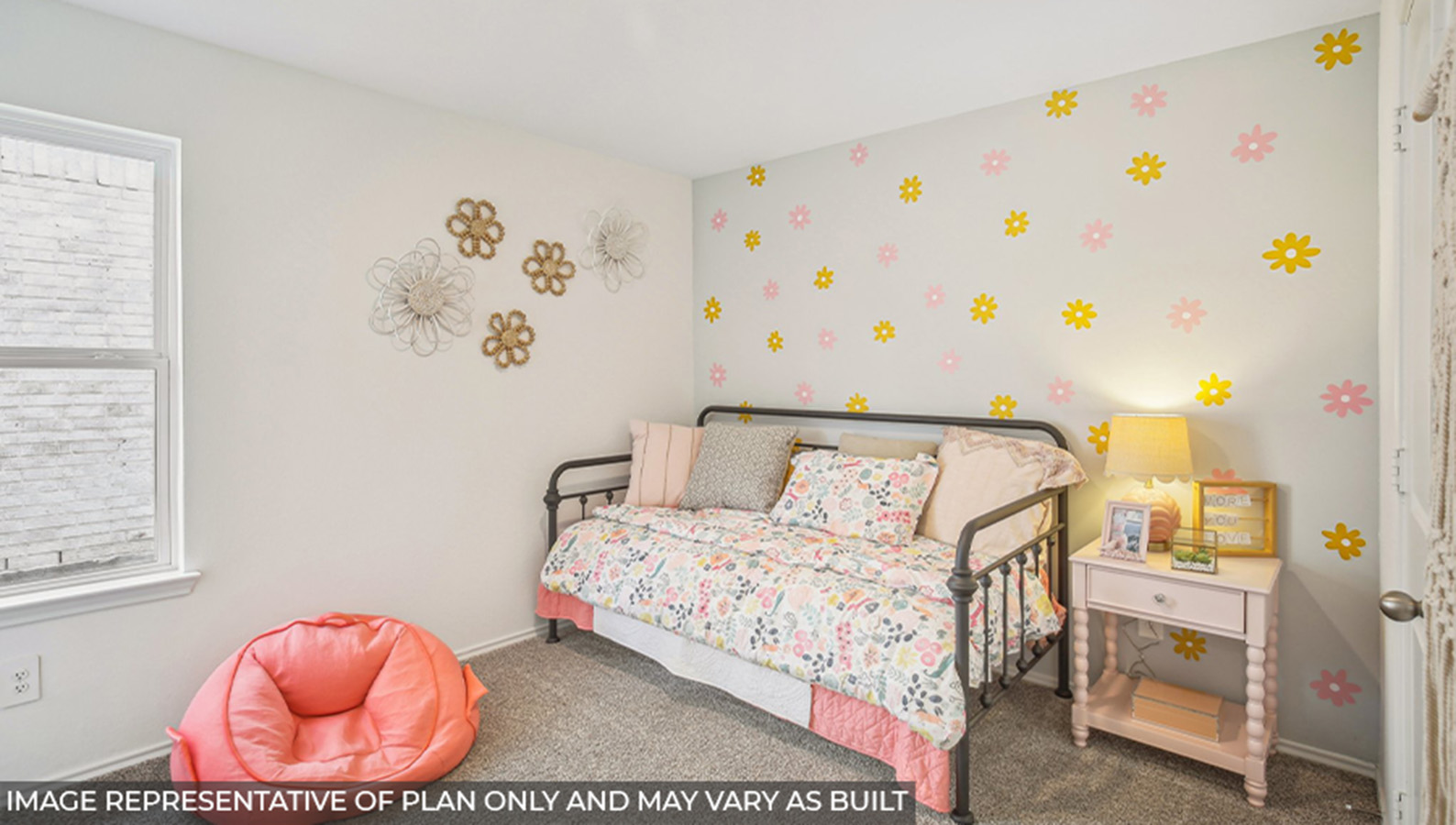 Secondary bedroom with carpet flooring