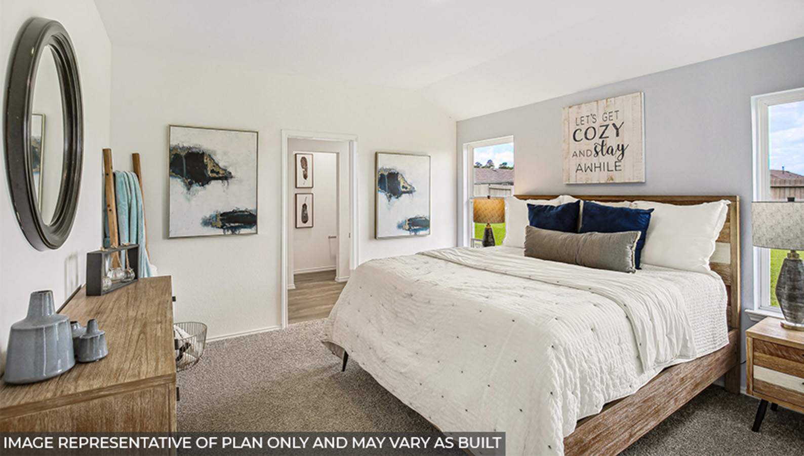 Primary bedroom with bright windows