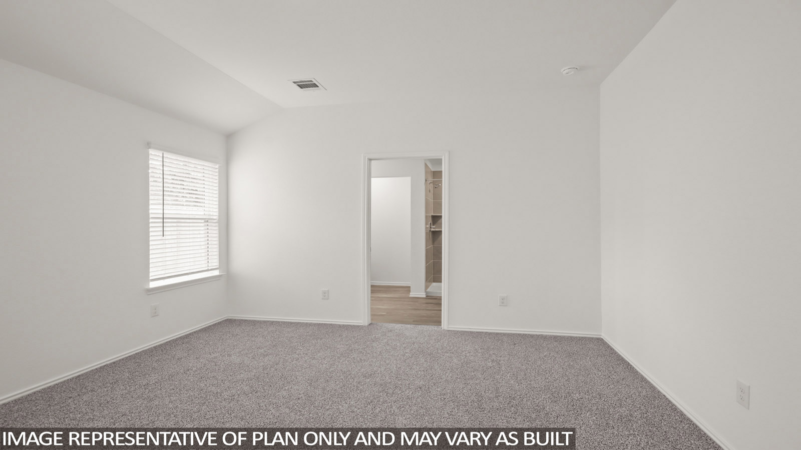 Primary bedroom with carpet flooring