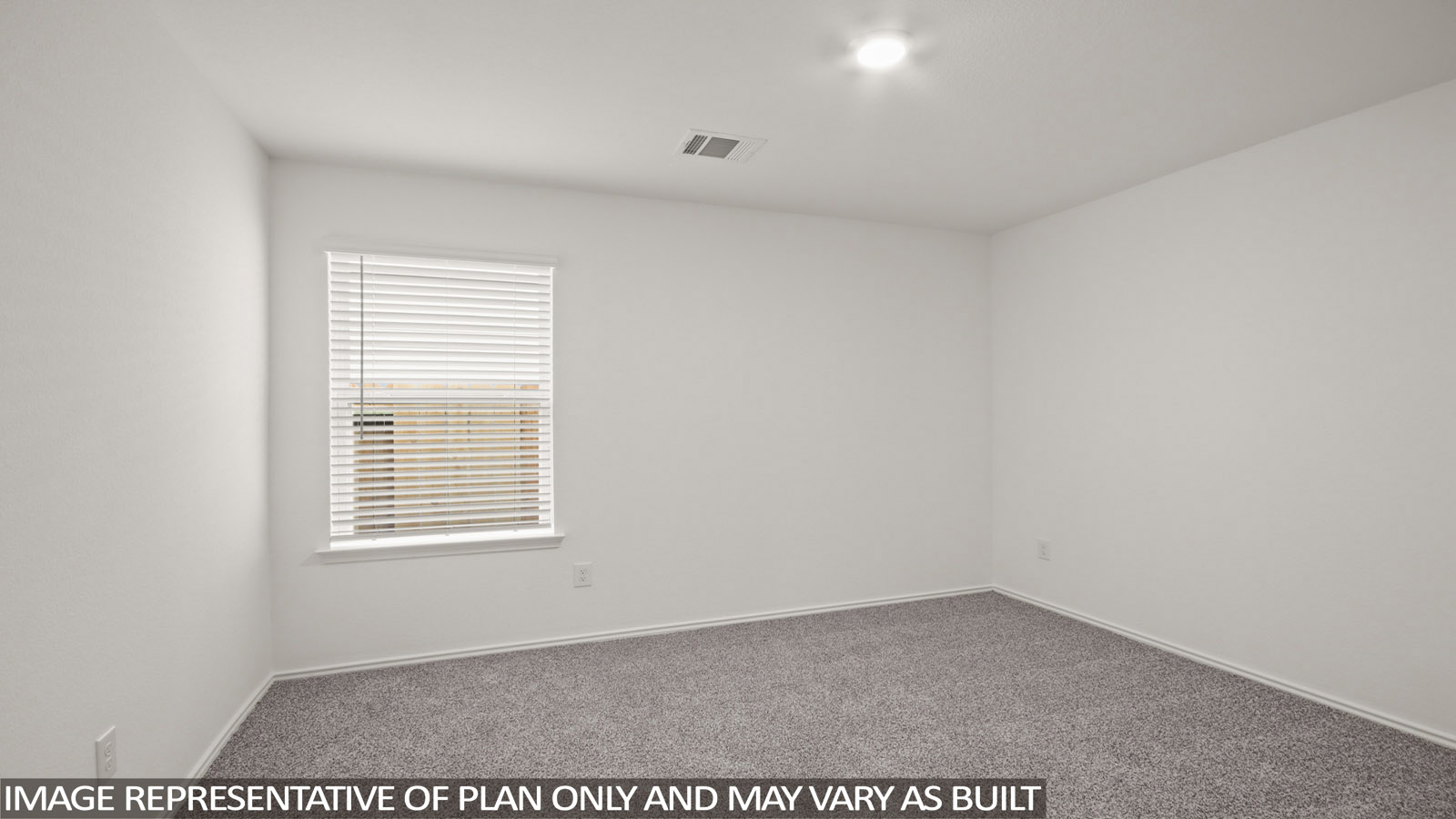 Secondary bedroom with carpet flooring
