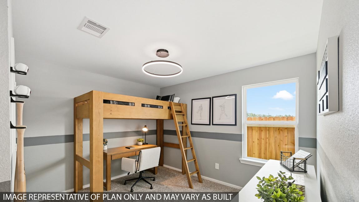 Secondary bedroom with carpet flooring