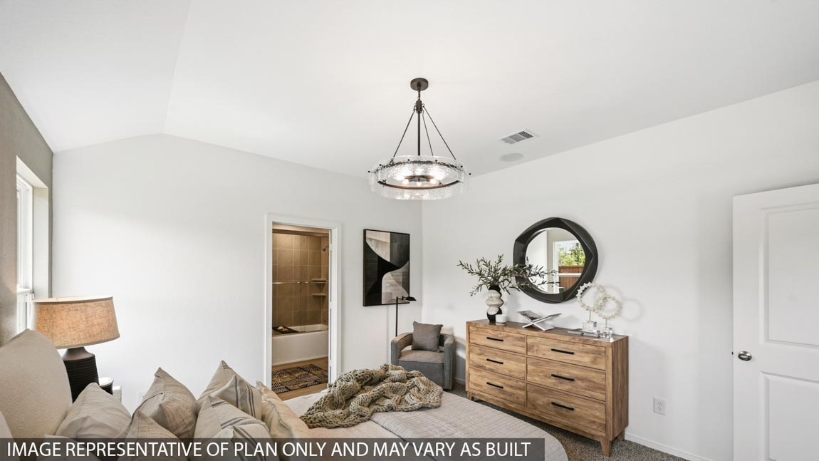 Primary bedroom with carpet flooring
