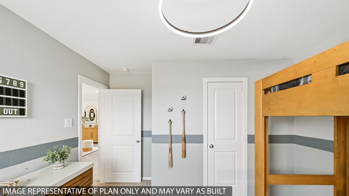 Secondary bedroom with carpet flooring