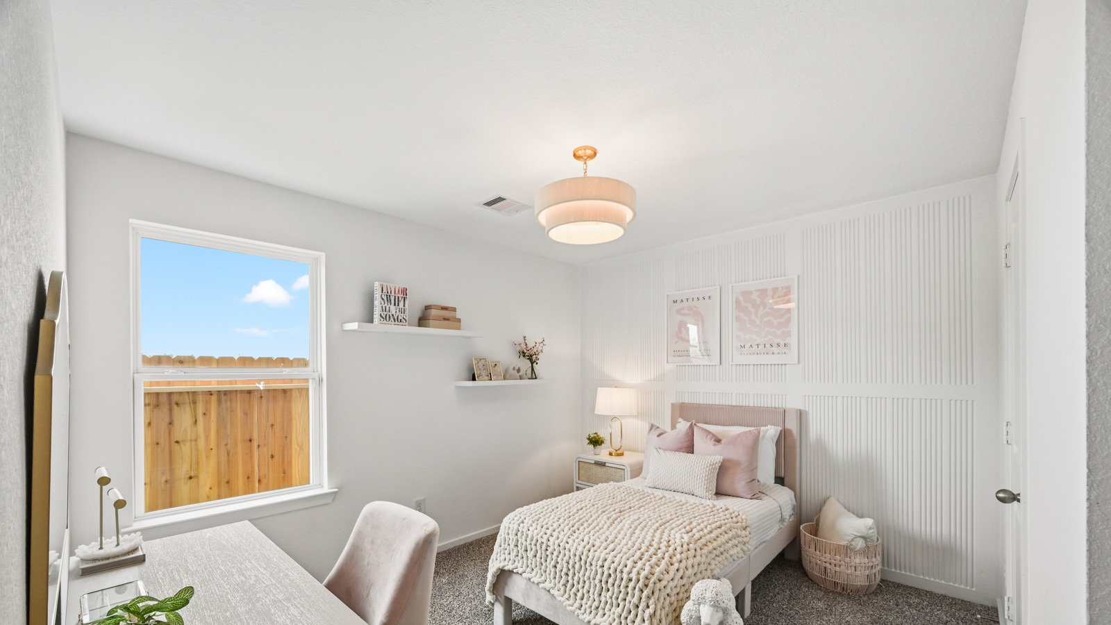 Secondary bedroom with carpet flooring