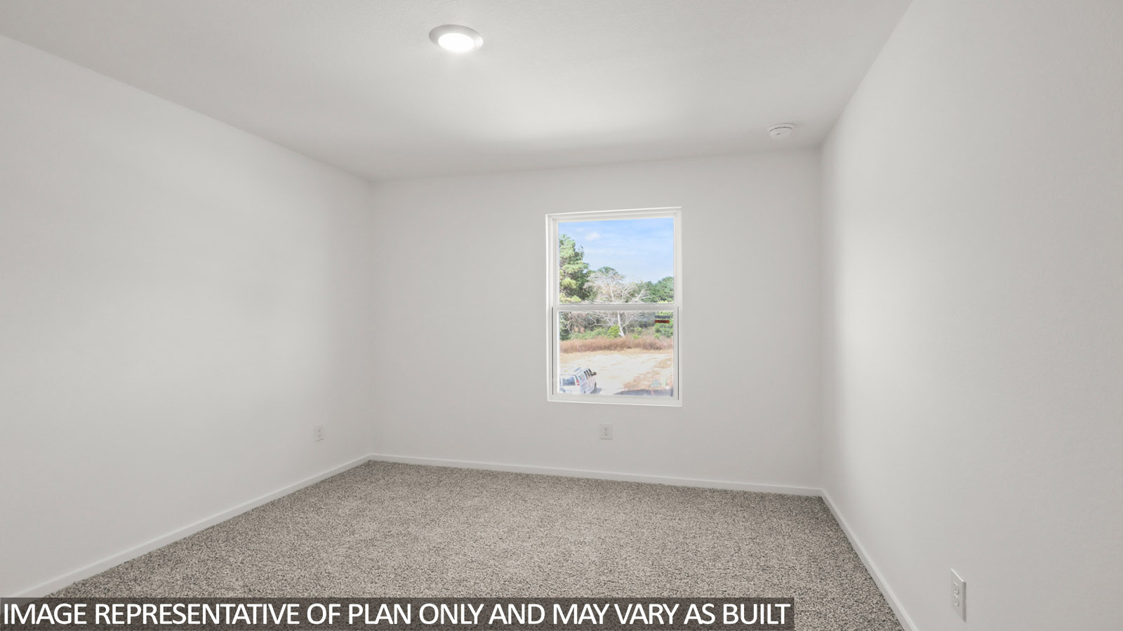 Secondary bedroom with carpet flooring