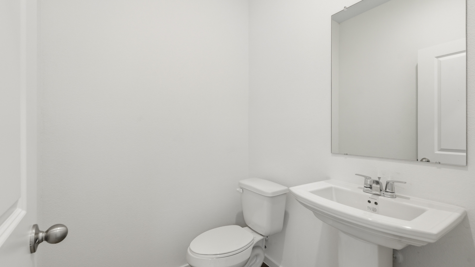 Powder bathroom with pedestal sink