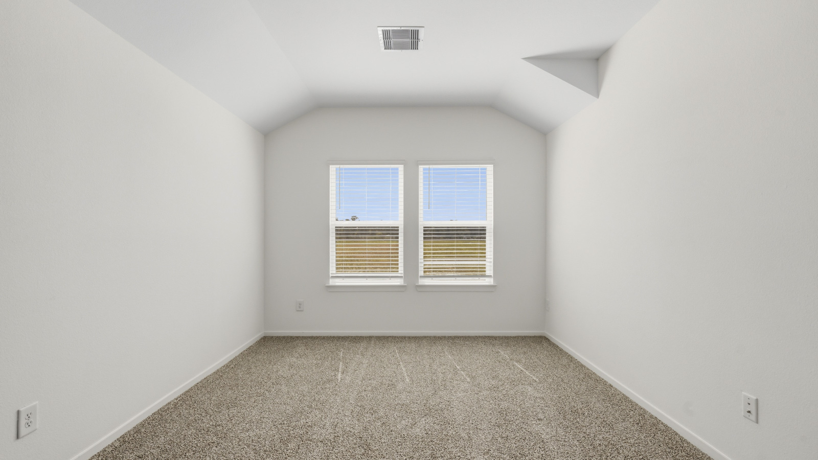 Second story game room with carpet flooring