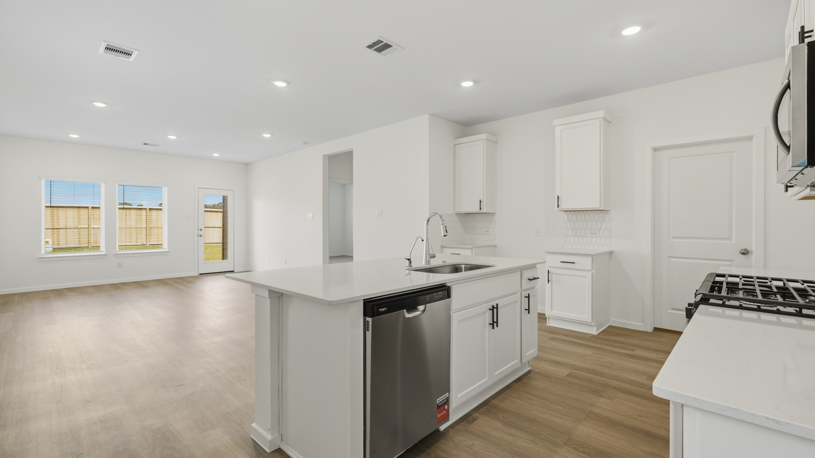 Open concept living, dining, and kitchen area