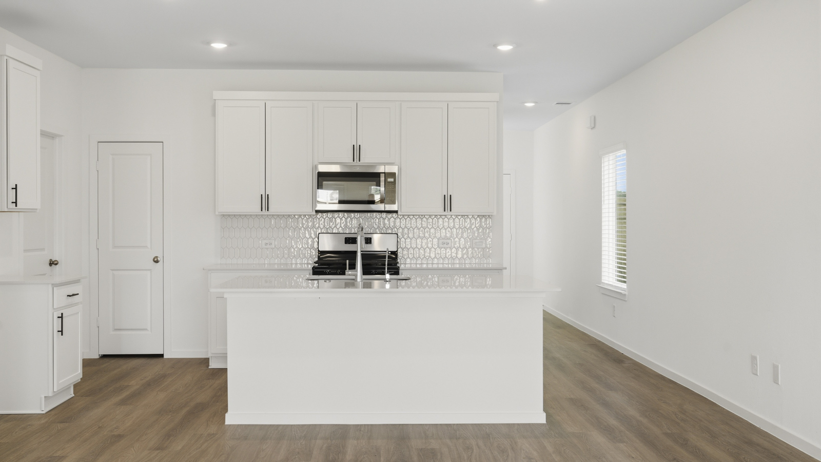 Open concept living, dining, and kitchen area