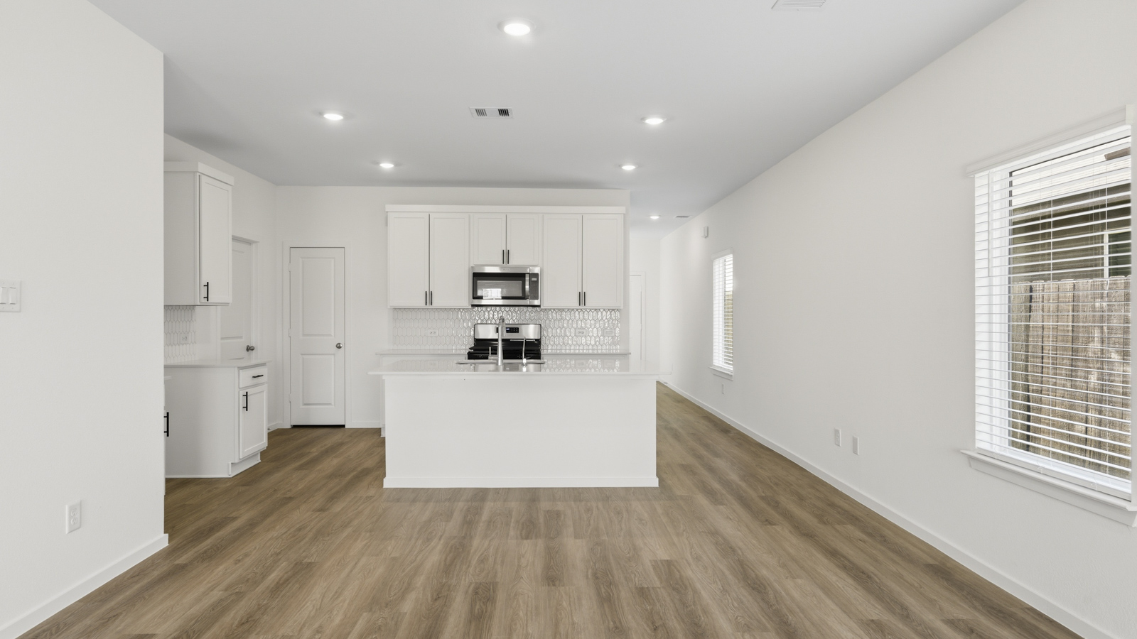 Open concept living, dining, and kitchen area