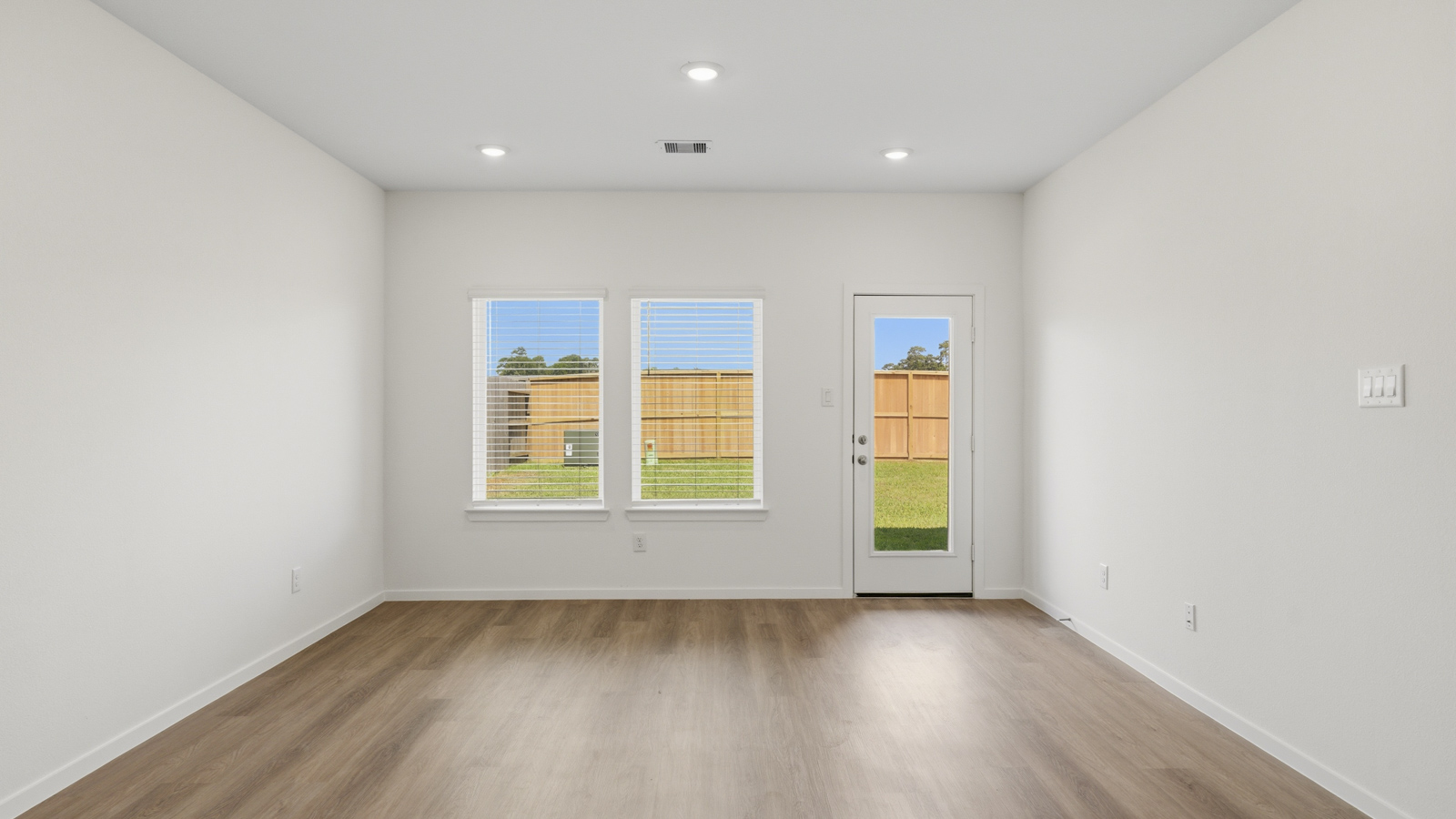 Open concept living, dining, and kitchen area