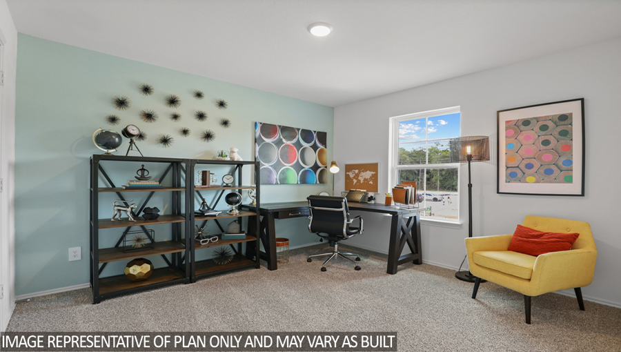 Secondary bedroom with carpet flooring