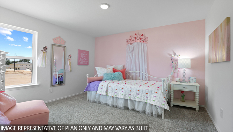 Secondary bedroom with carpet flooring