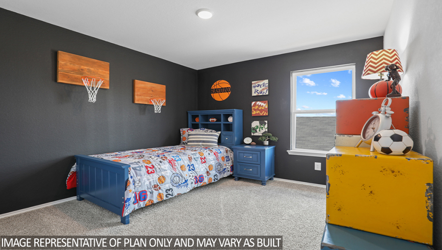 Secondary bedroom with carpet flooring