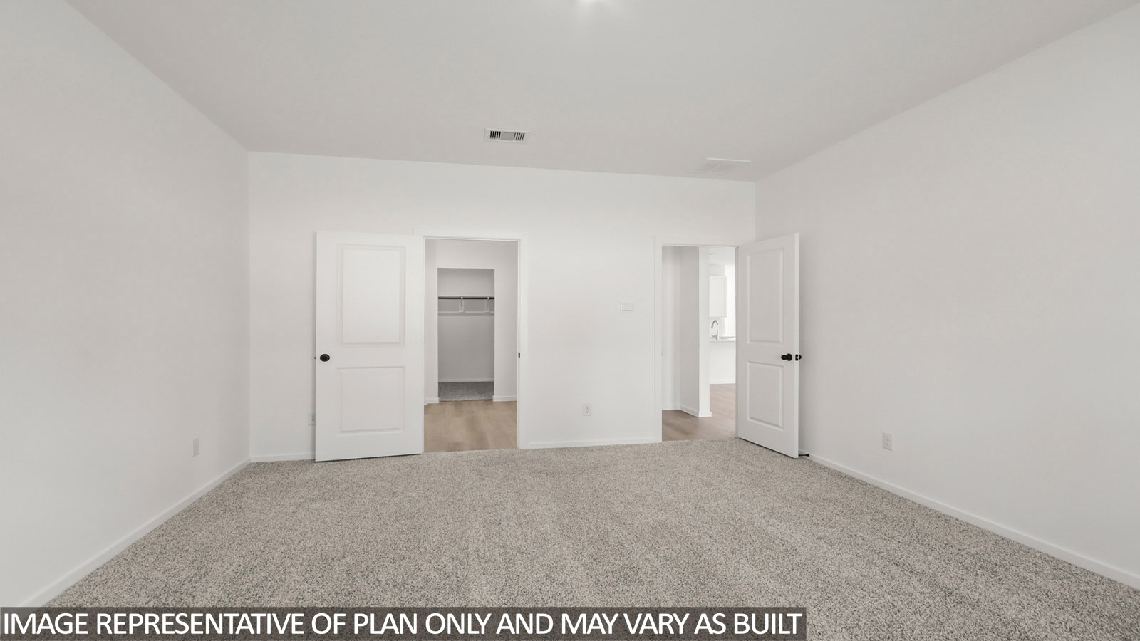 Primary bedroom with carpet flooring