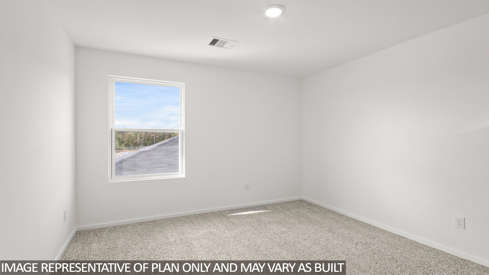 Secondary bedroom with carpet flooring