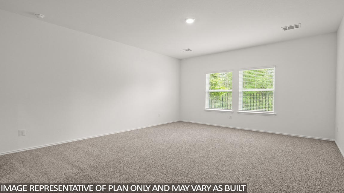 Primary bedroom with bright windows