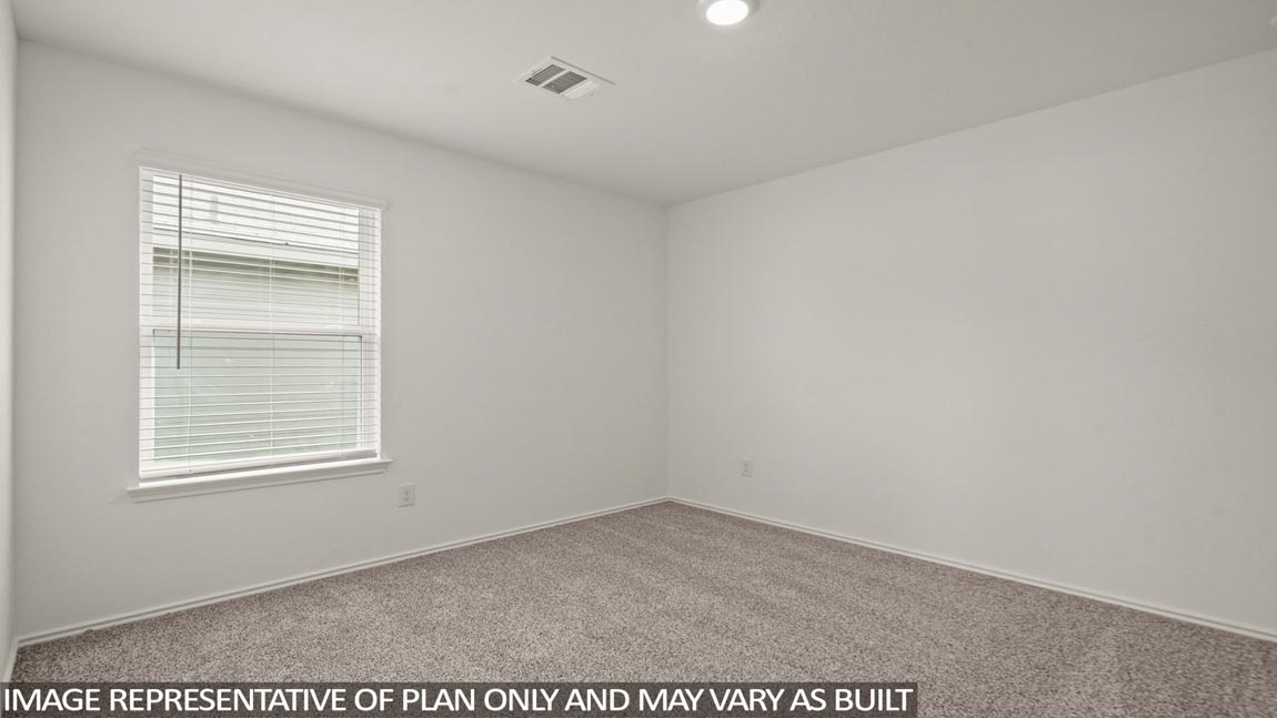 secondary bedroom with carpet flooring
