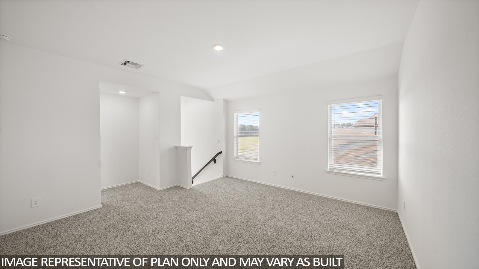 Primary bedroom with carpet flooring