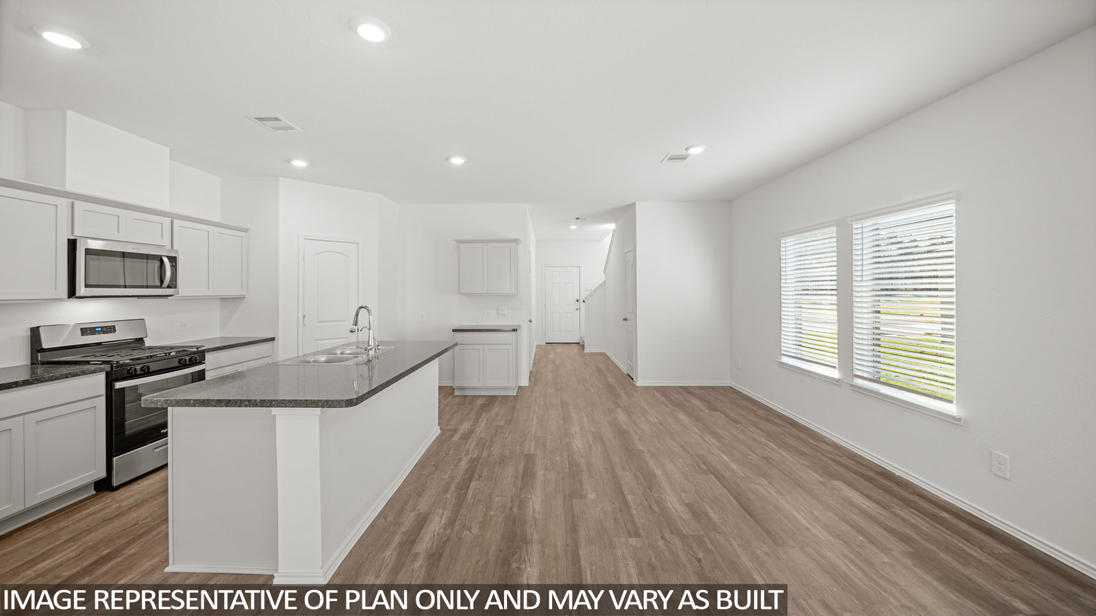 Open concept living, dining, and kitchen area