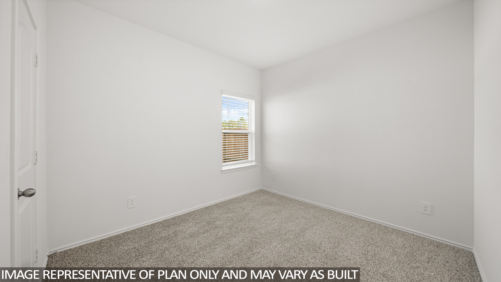 Secondary bedroom with carpet flooring