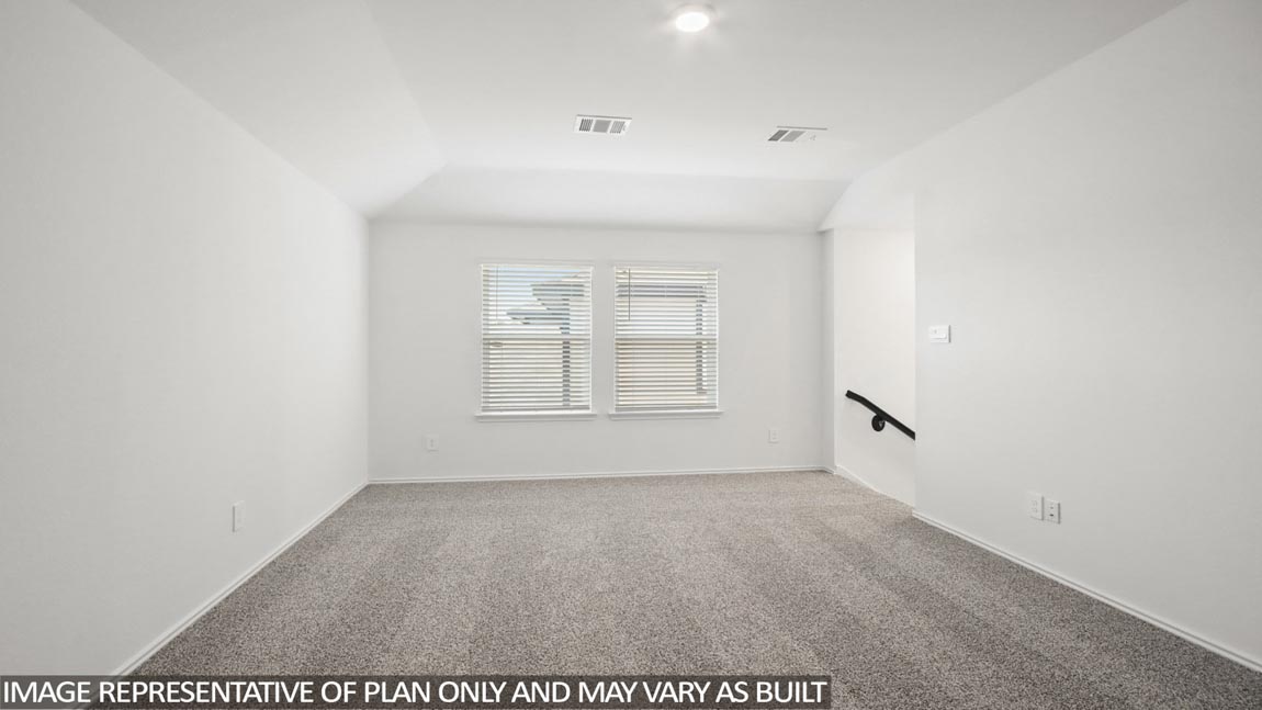 Second story game room with carpet flooring