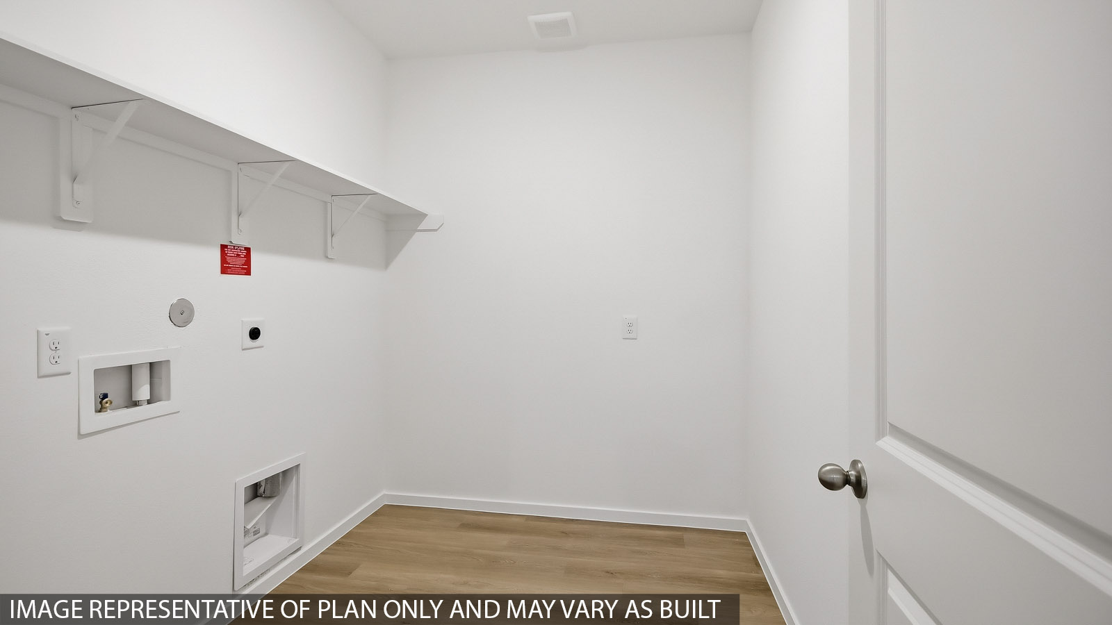 utility room with vinyl flooring