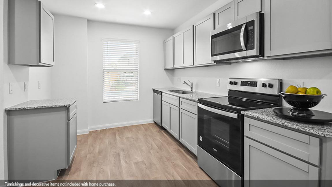 Kitchen with stainless-steel appliances.