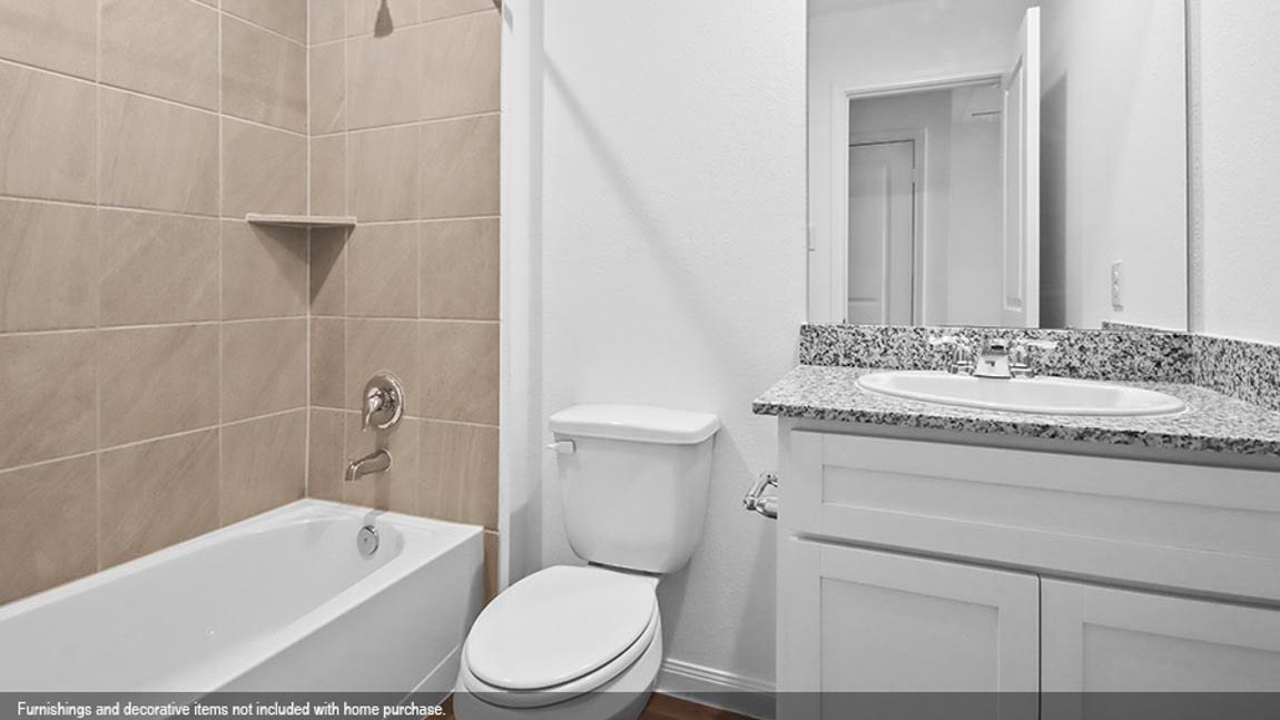 Secondary bathroom with tub/shower combo.