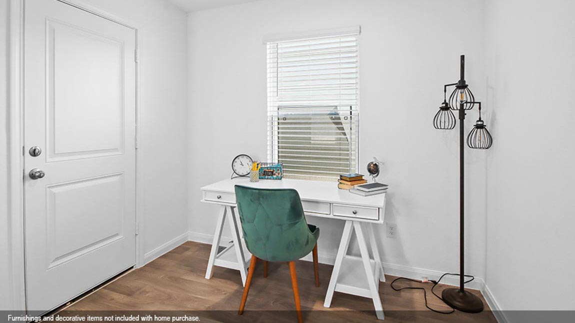 Secondary bedroom/private study with vinyl flooring and a bright window.