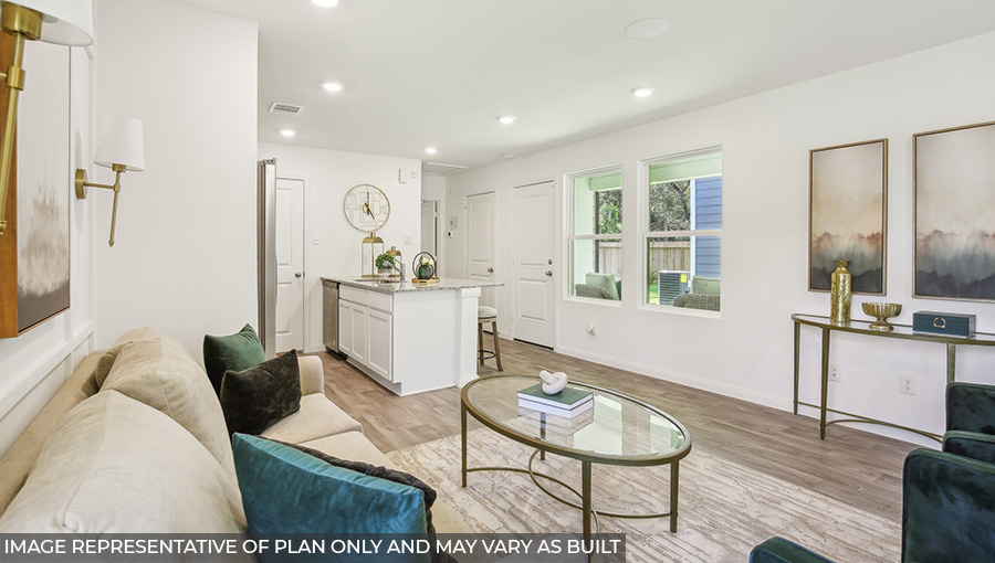 Spacious living area with vinyl flooring