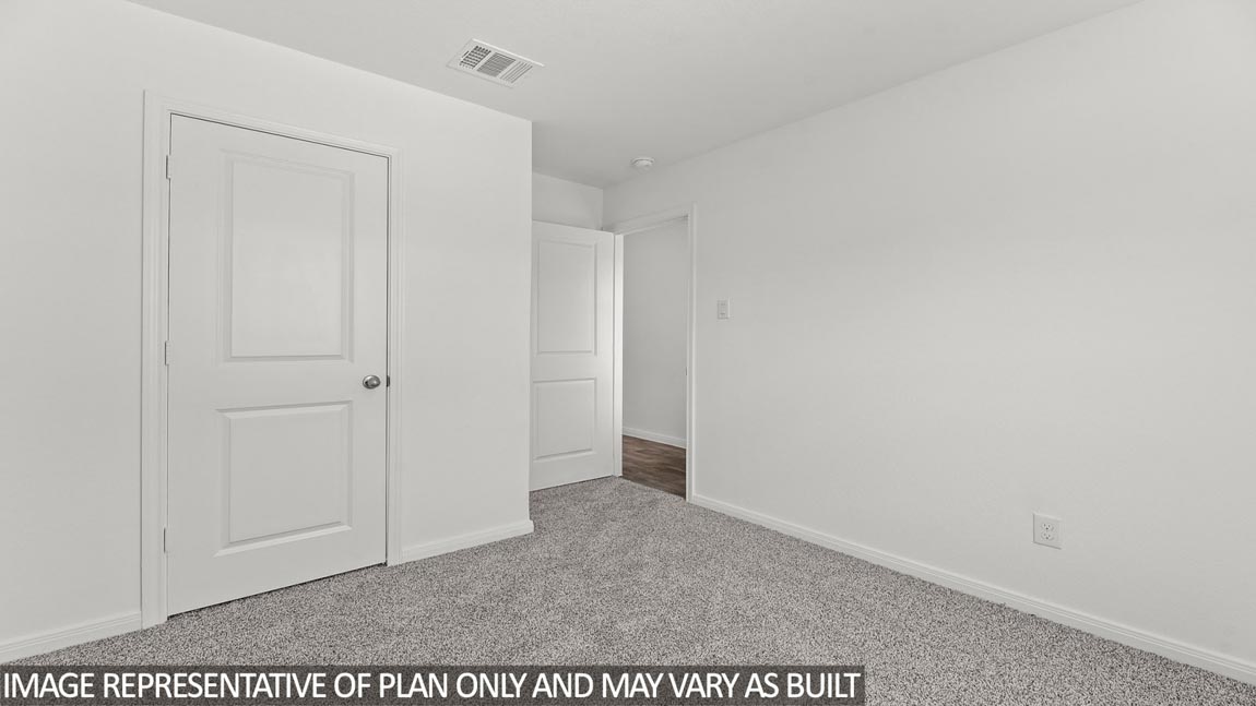 secondary bedroom with tall closet