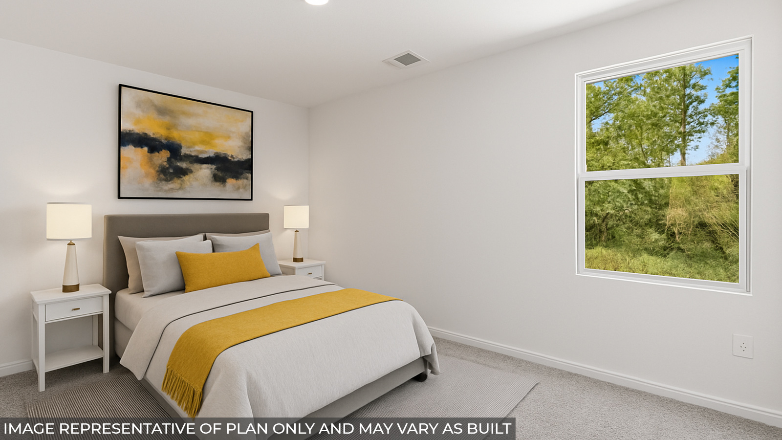Staged primary bedroom with carpet flooring and a bright window.