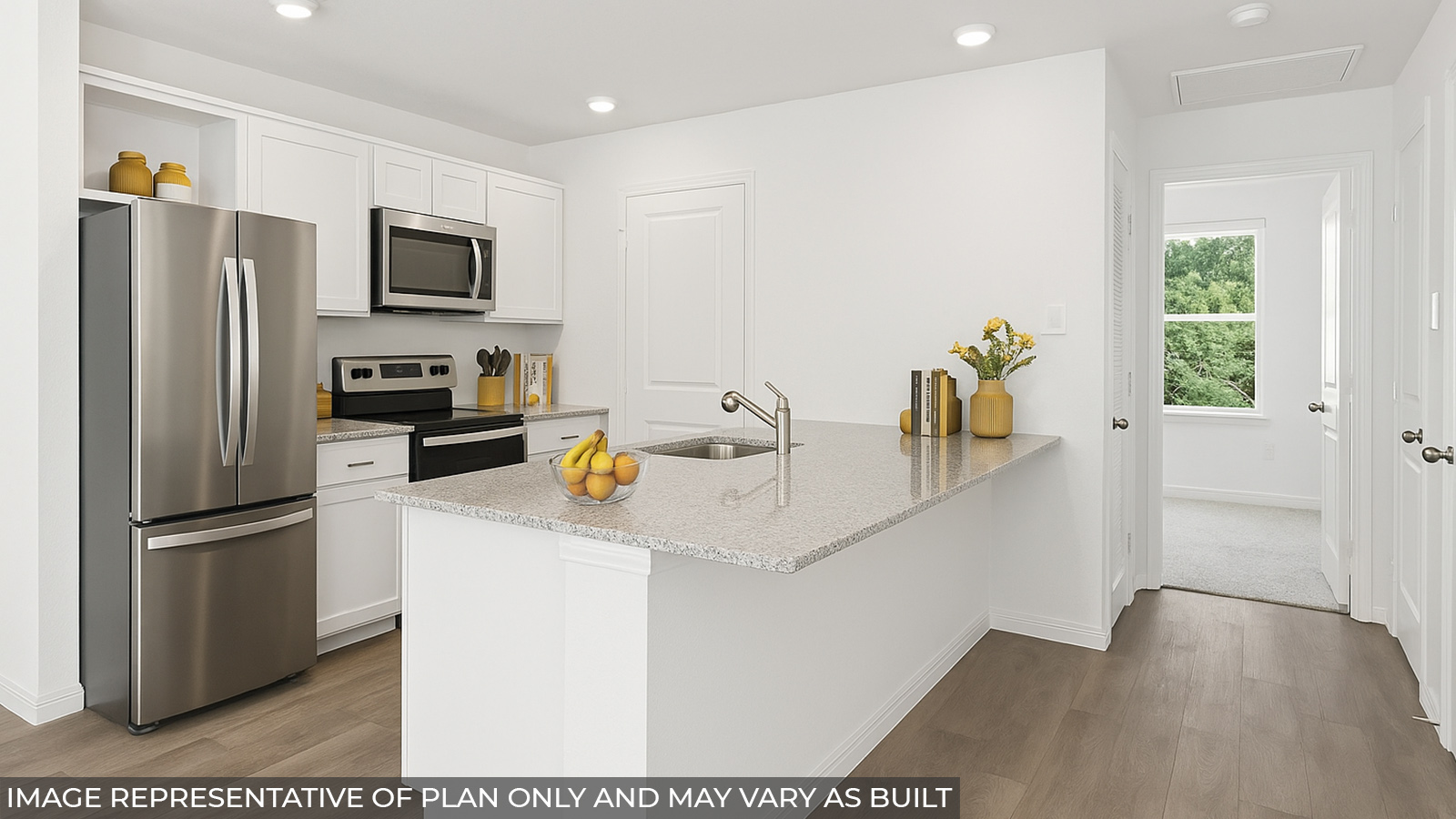 Staged kitchen with vinyl flooring and stainless-steel appliances.