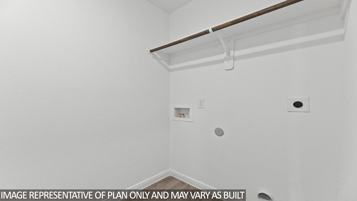 utility room with vinyl flooring