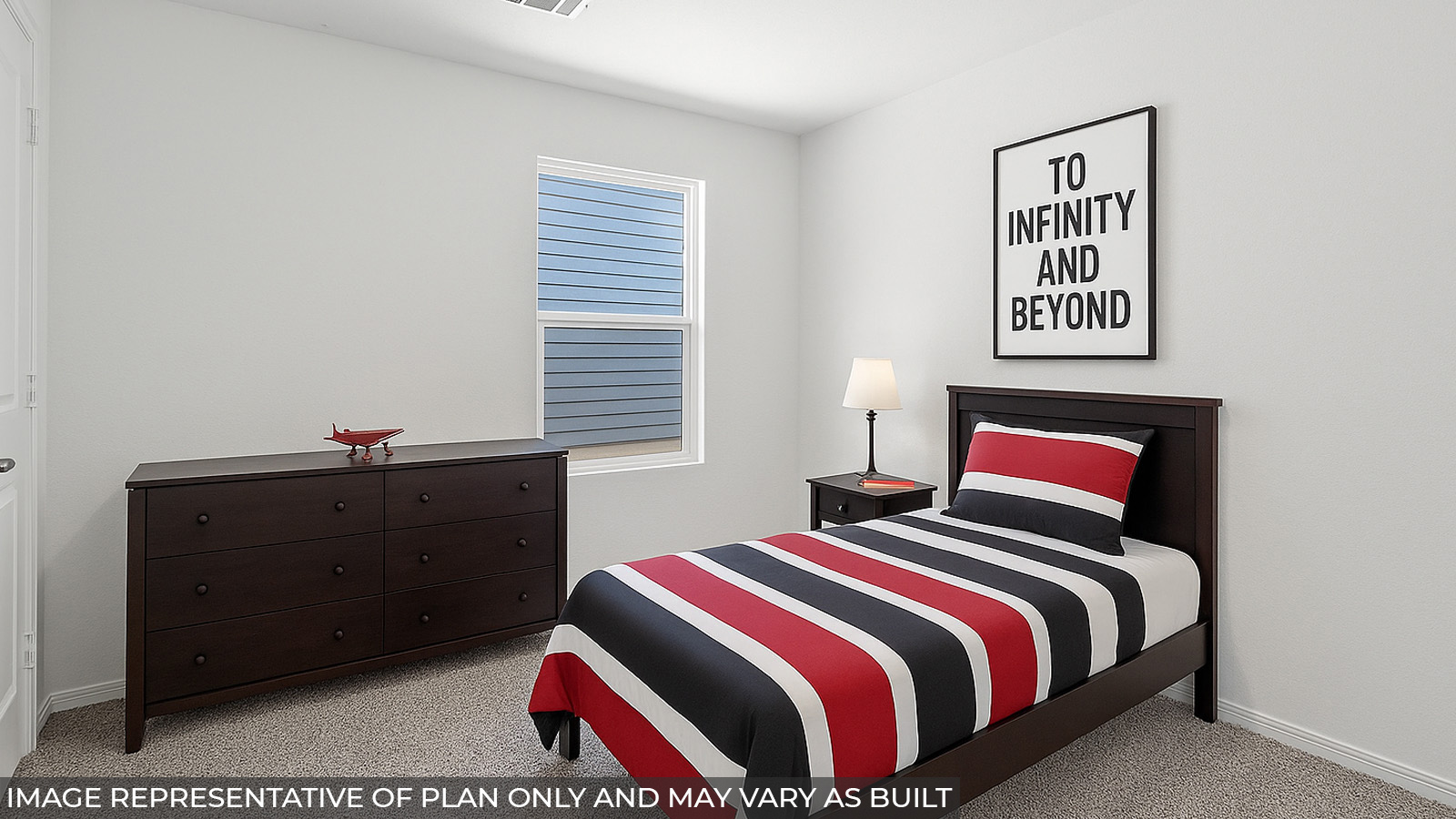 Secondary bedroom with carpet flooring