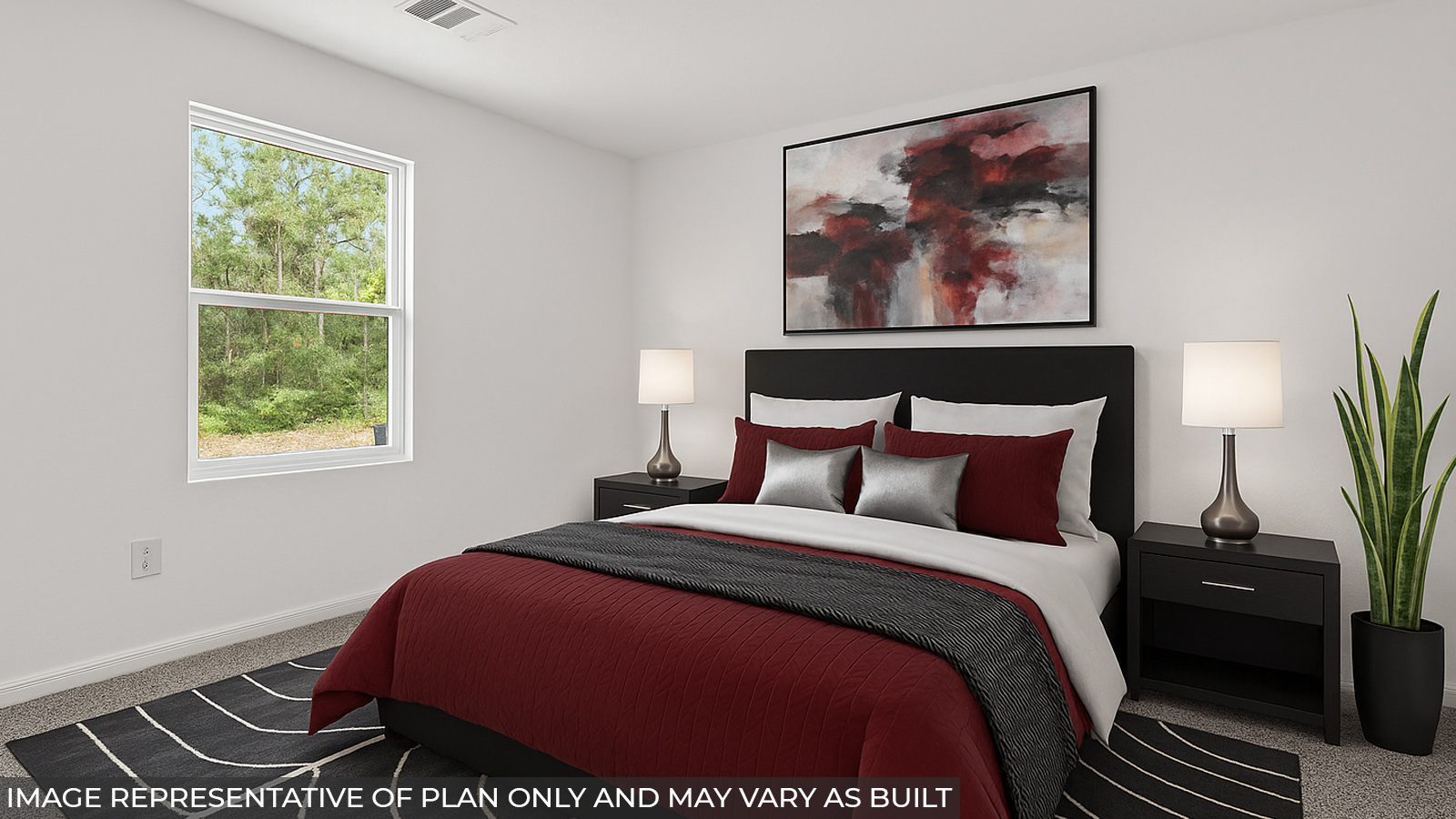 Primary bedroom with bright windows