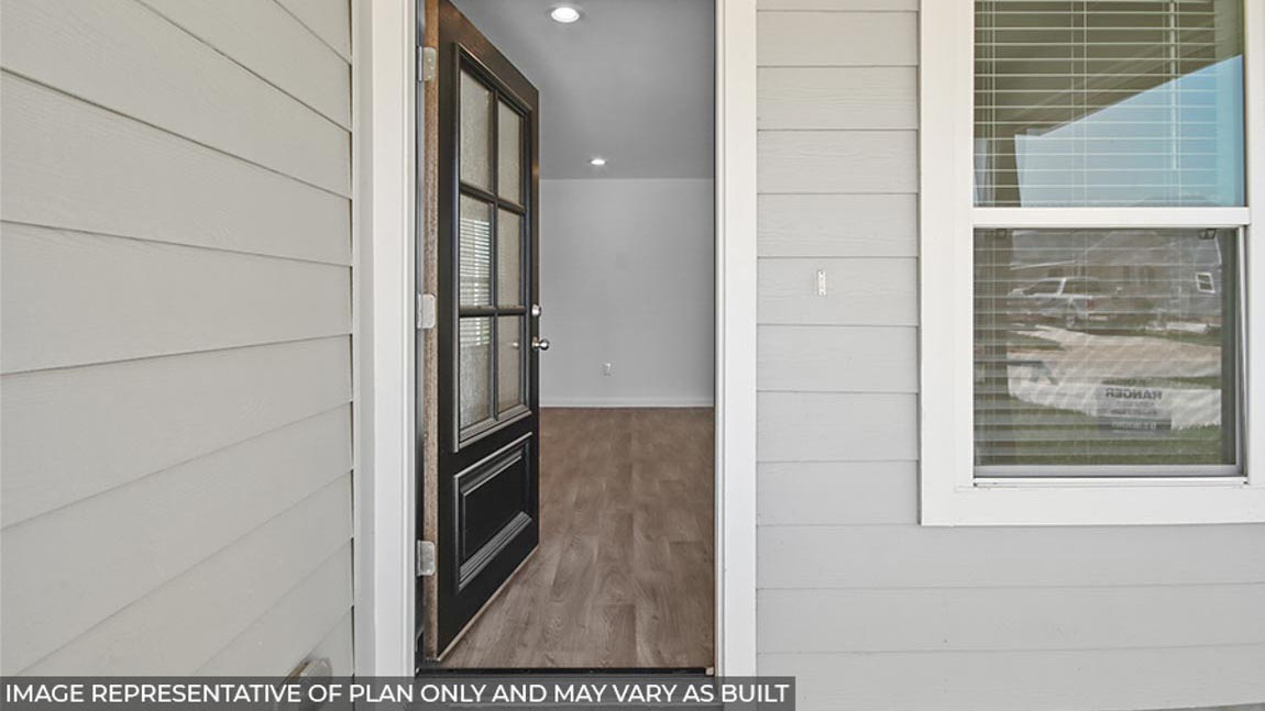 Entryway and foyer with vinyl flooring.