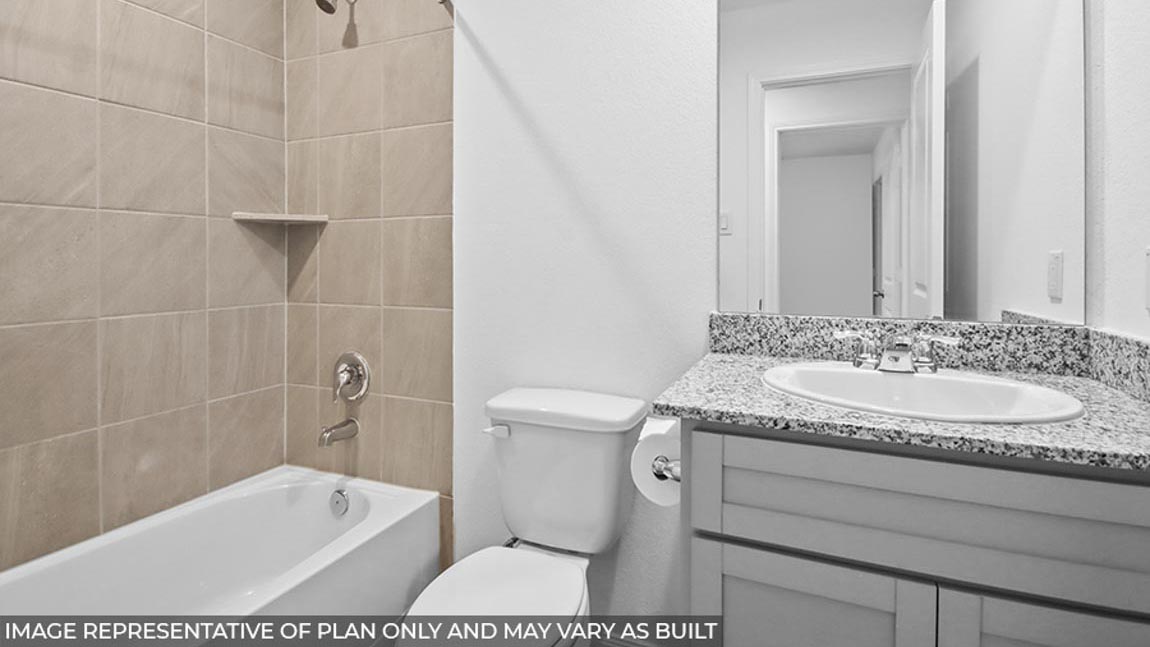 Secondary bathroom with tub/shower combo.