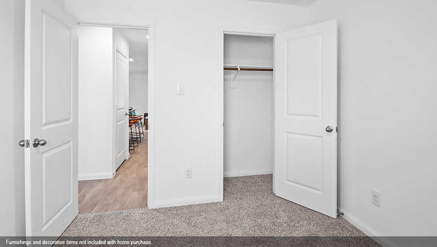 Primary bedroom with carpet flooring