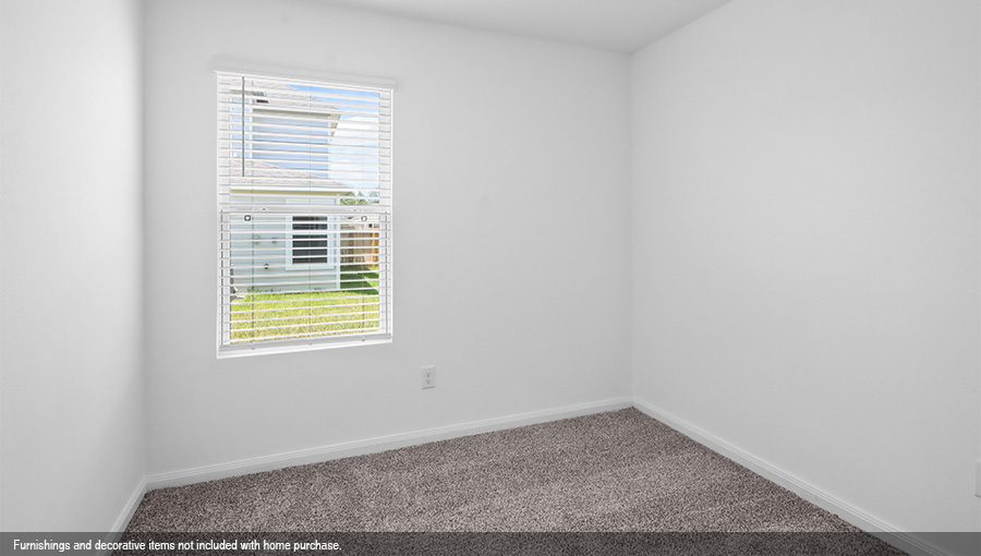 Primary bedroom with carpet flooring