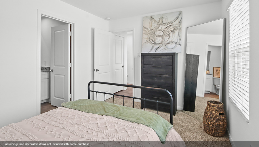 Primary bedroom with carpet flooring