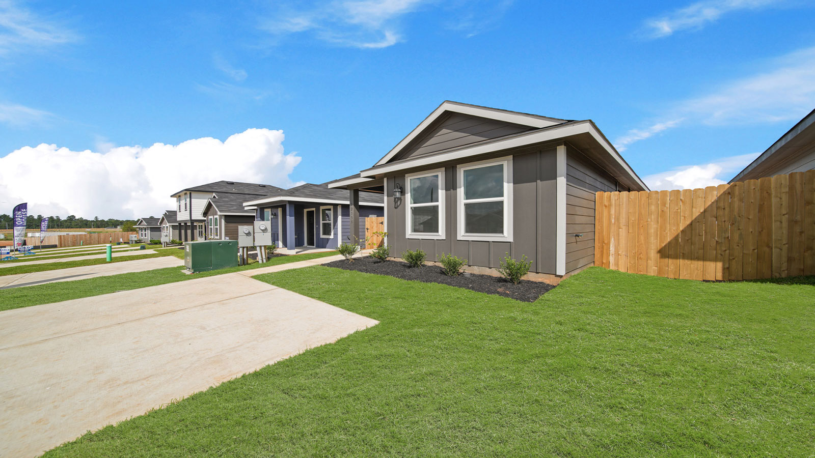 Single-story home with white trim.