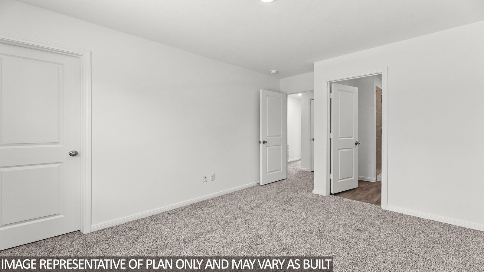 Secondary bedroom with carpet flooring