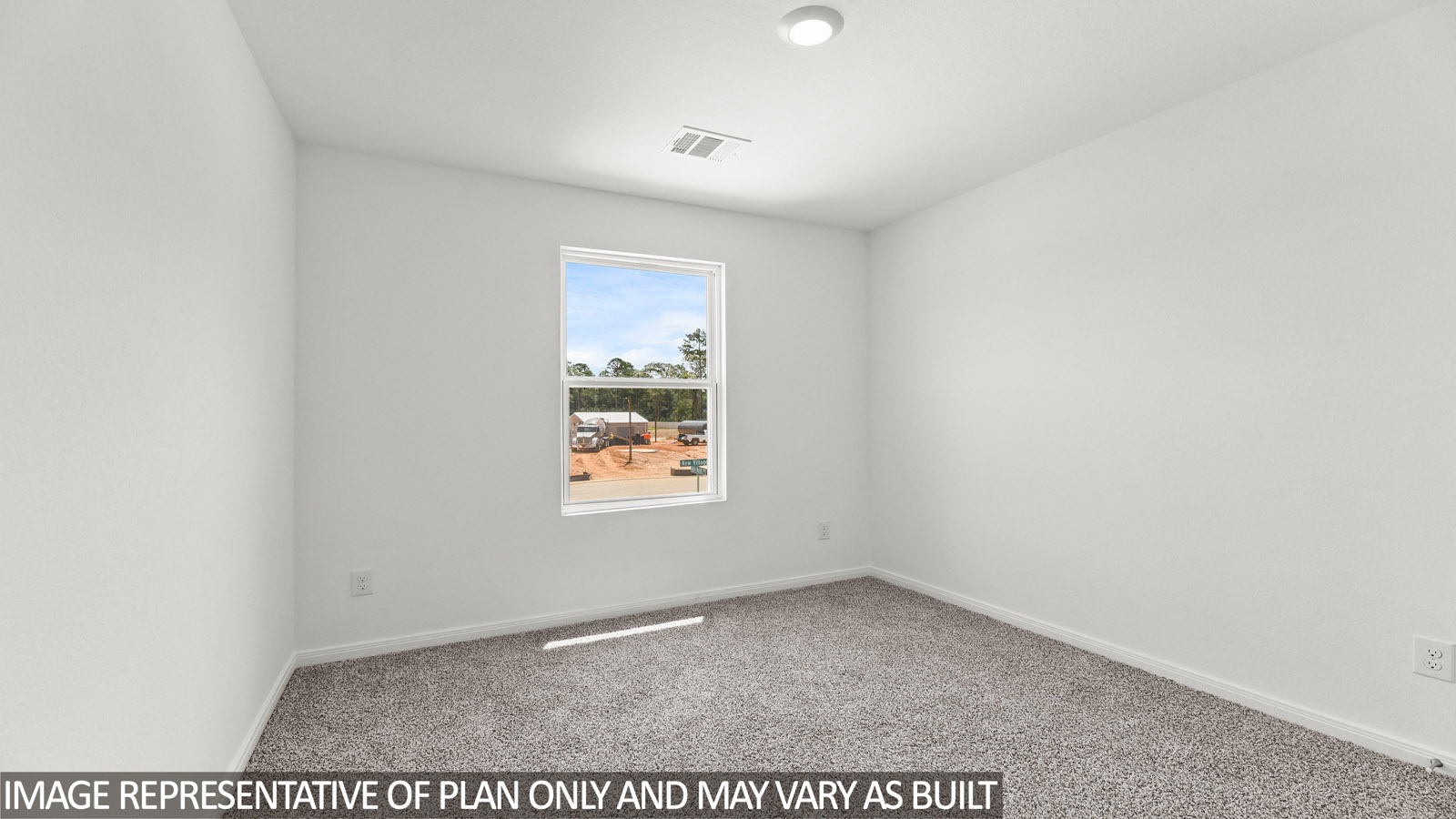 Secondary bedroom with carpet flooring