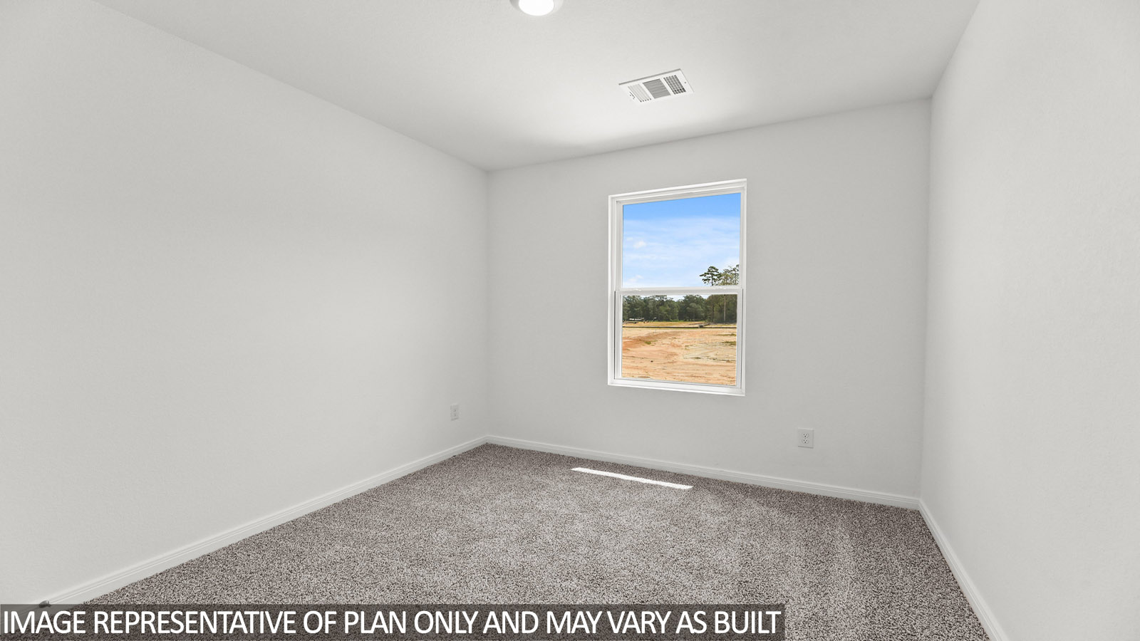 Primary bedroom with carpet flooring