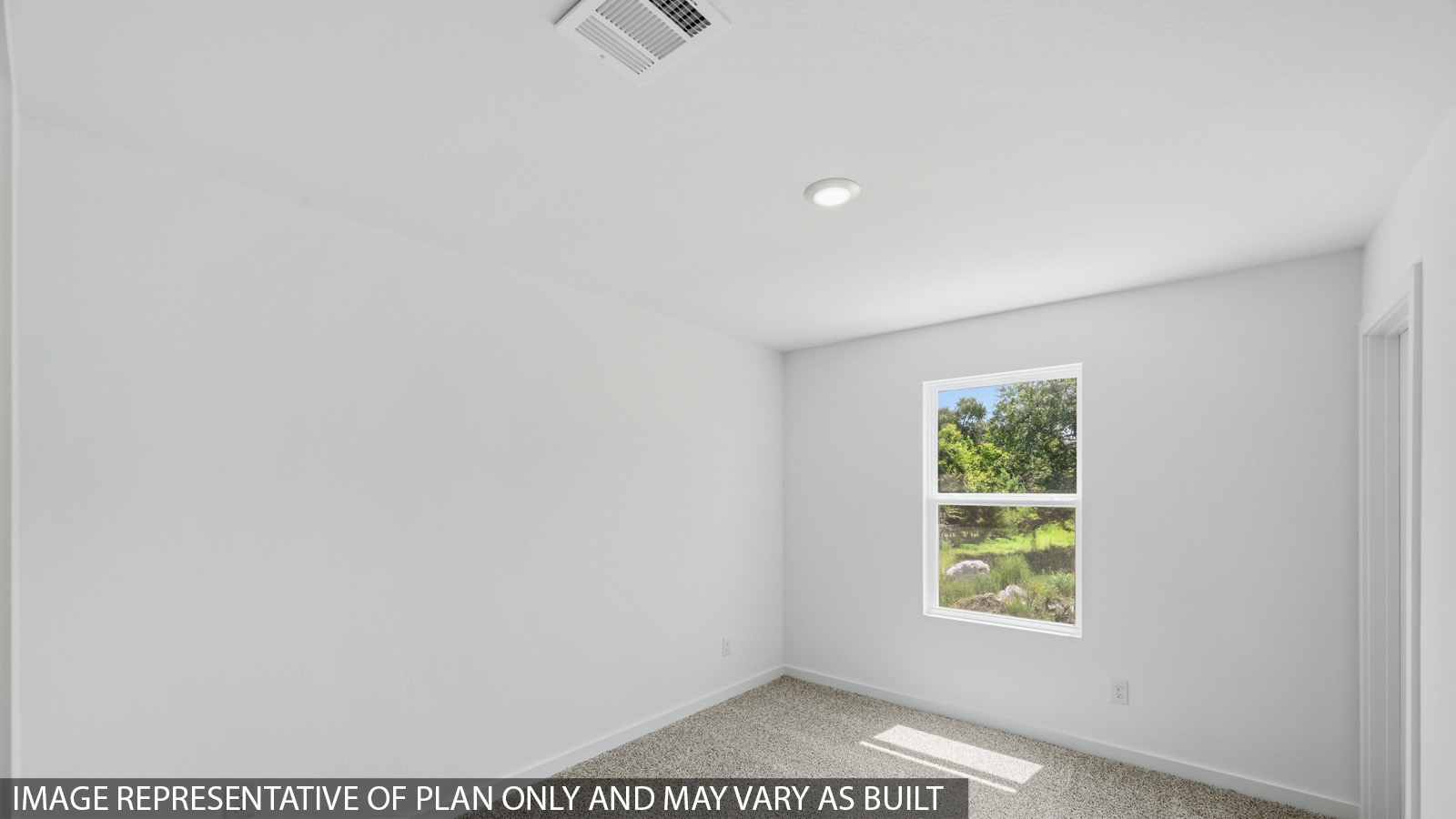 Secondary bedroom with carpet flooring