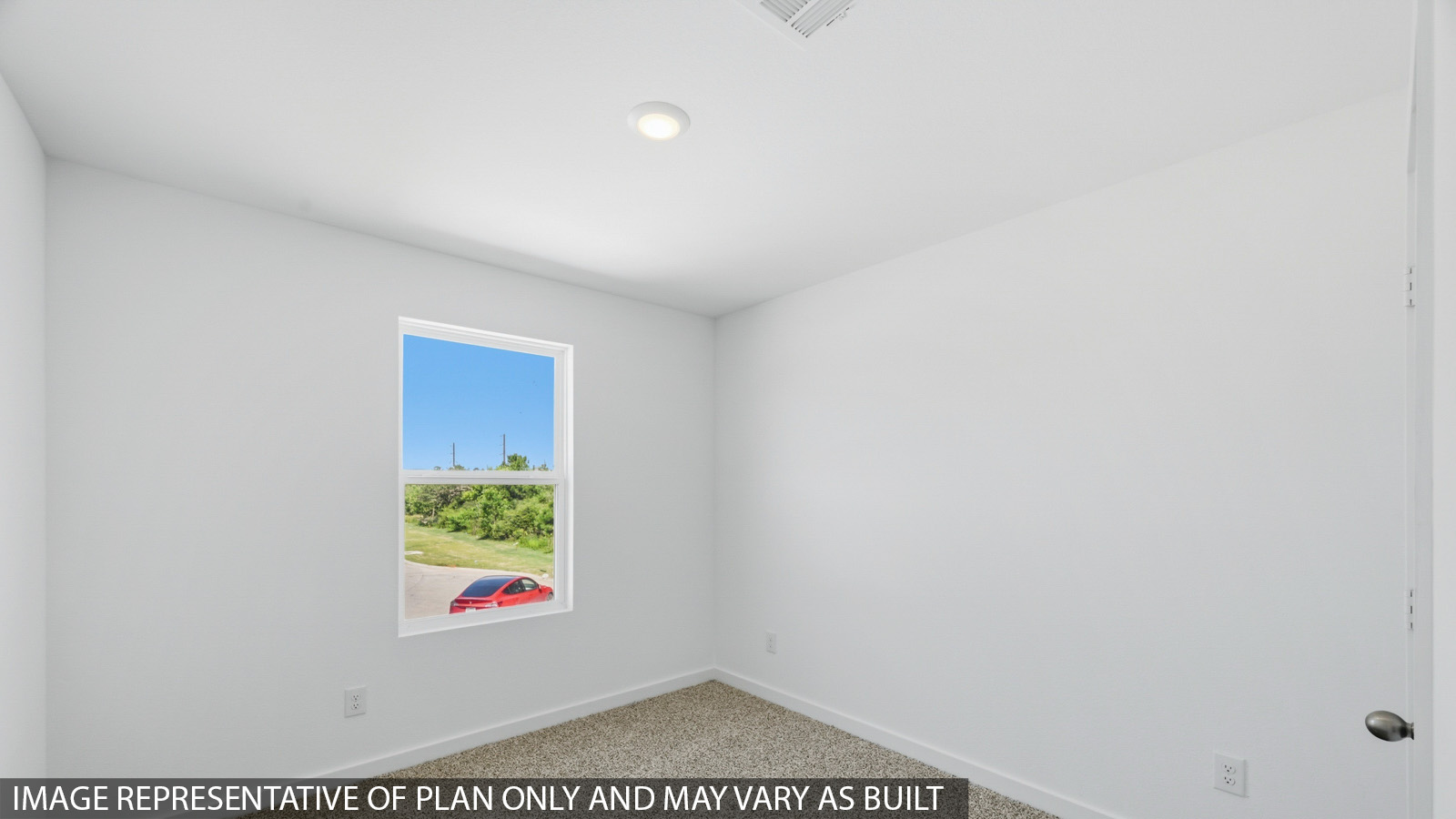 Primary bedroom with carpet flooring