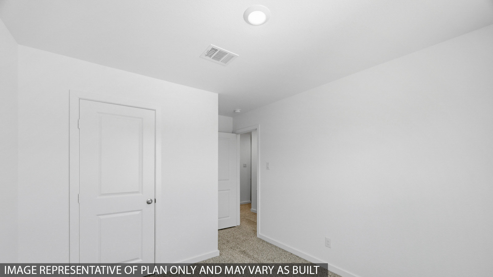 Primary bedroom with carpet flooring
